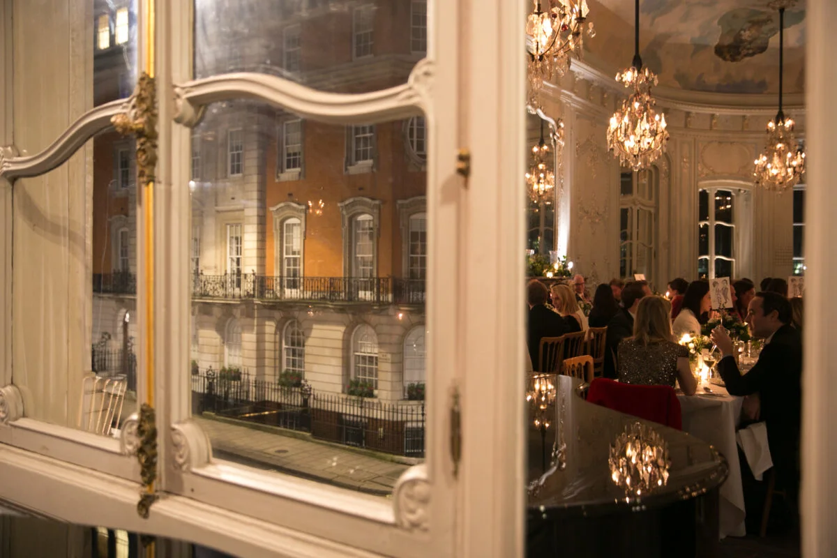 A window with a view of a large building.