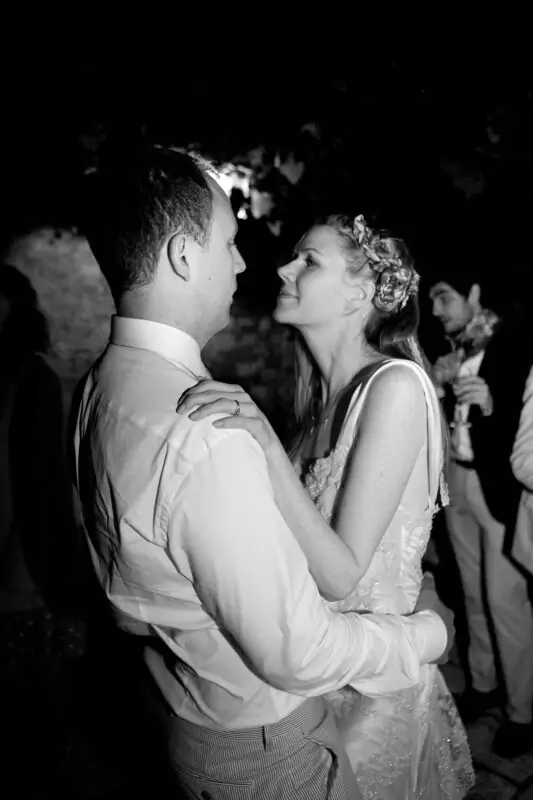 A bride and groom sharing a dance at a wedding.