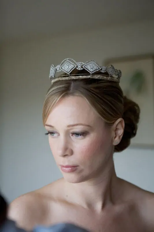 A bride with a tiara on her head.