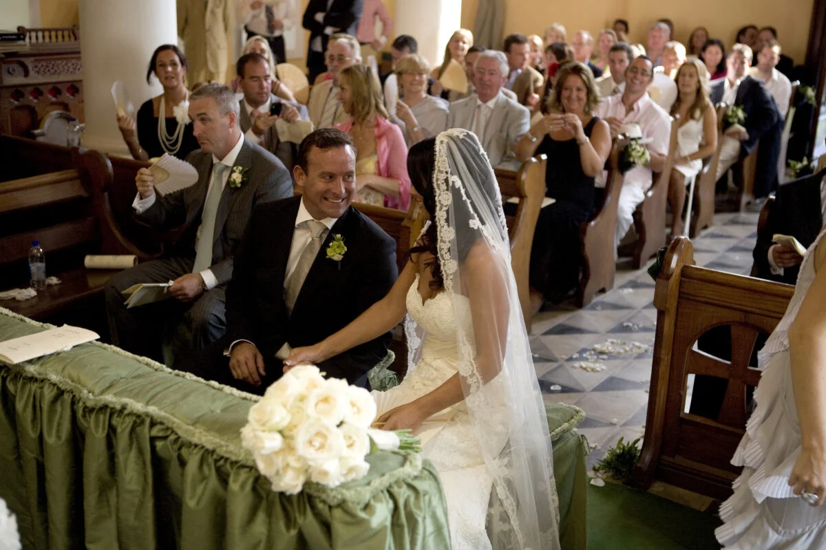 The bride is wearing a veil.
