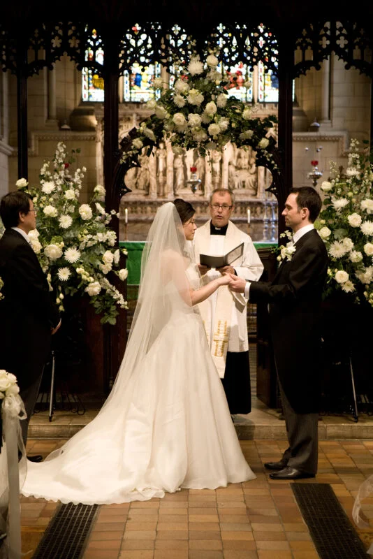 The bride is wearing a veil.