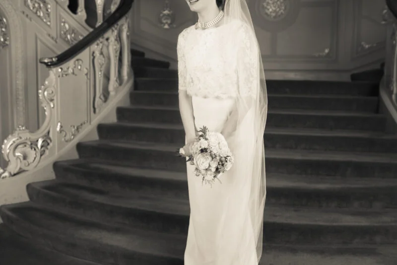 A fine art wedding photographer capturing a bride on a London staircase.