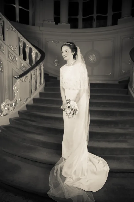 A fine art wedding photographer capturing a bride on a London staircase.