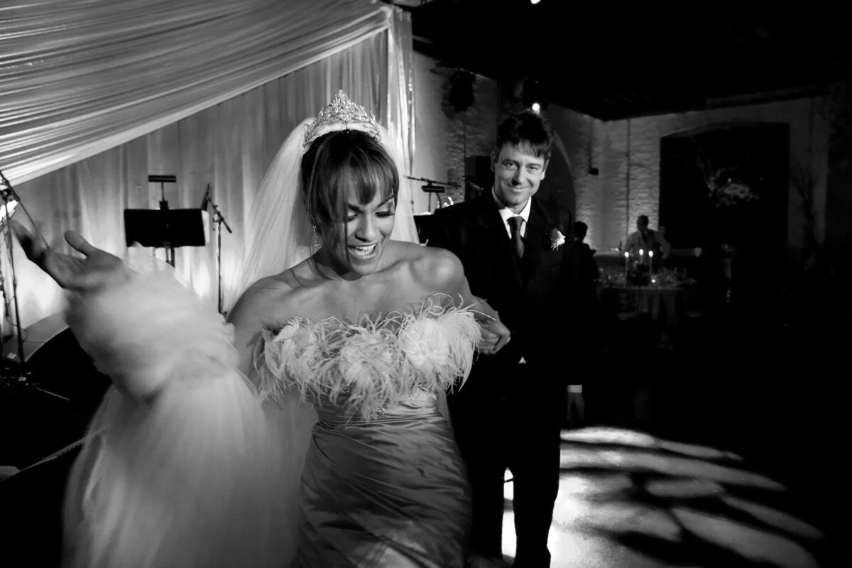A bride and groom dancing on the dance floor.