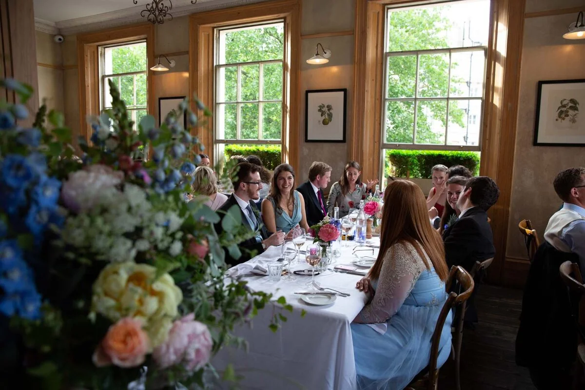 A group of people sitting at a table.