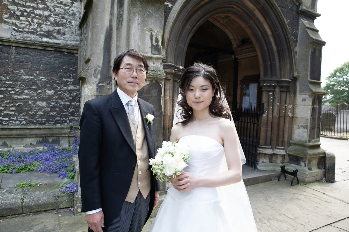 A man and a woman in a wedding dress.