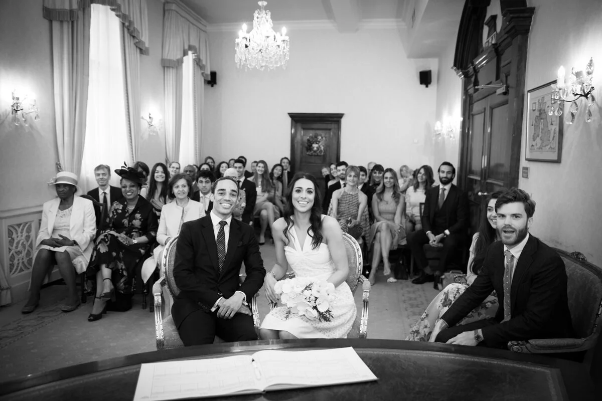 A black and white photo of a wedding ceremony.