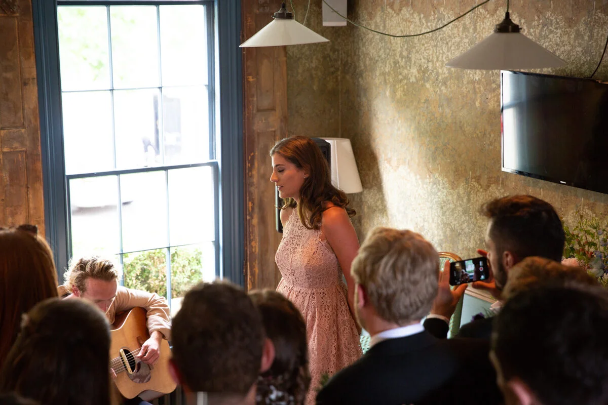 A woman in a pink dress.