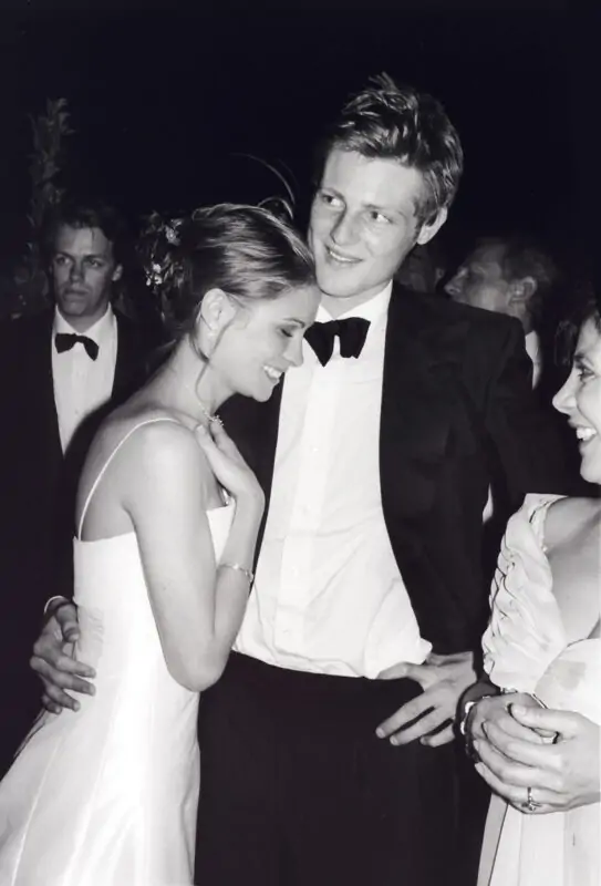 A black and white photo of a man and woman at a wedding.
