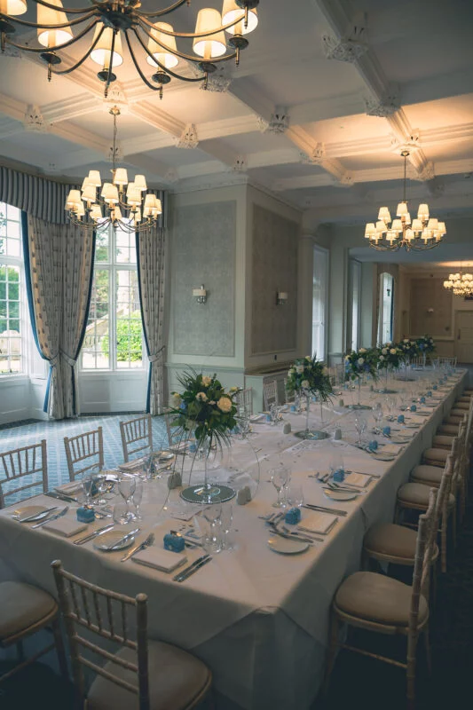 A long table is set up in a room.