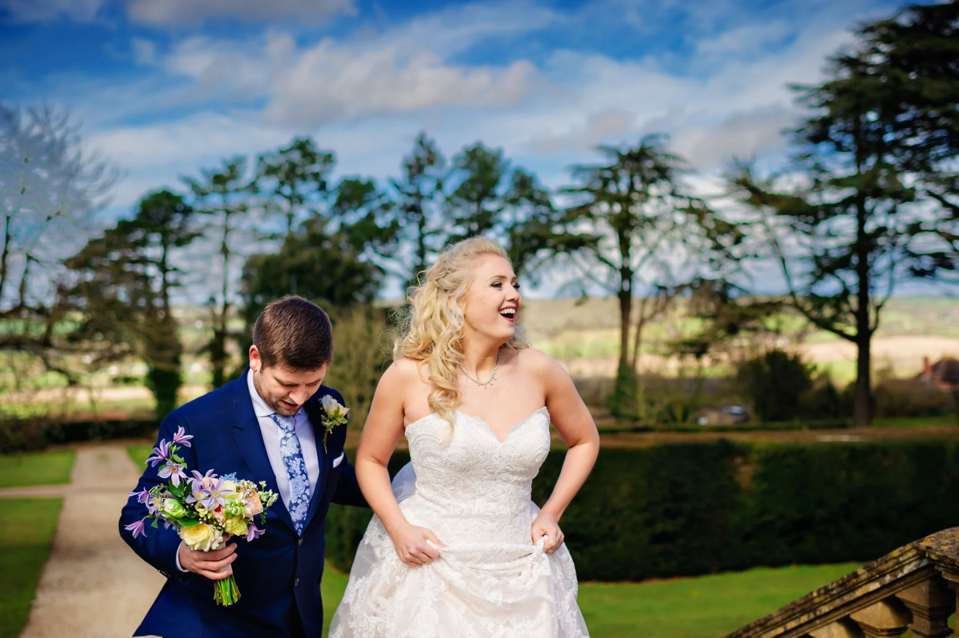 A cheap wedding photographer capturing laughter of a bride and groom at a country house in London. (listing)