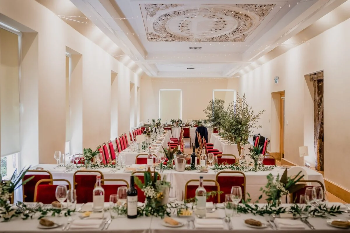 A wedding reception set up in a large room.