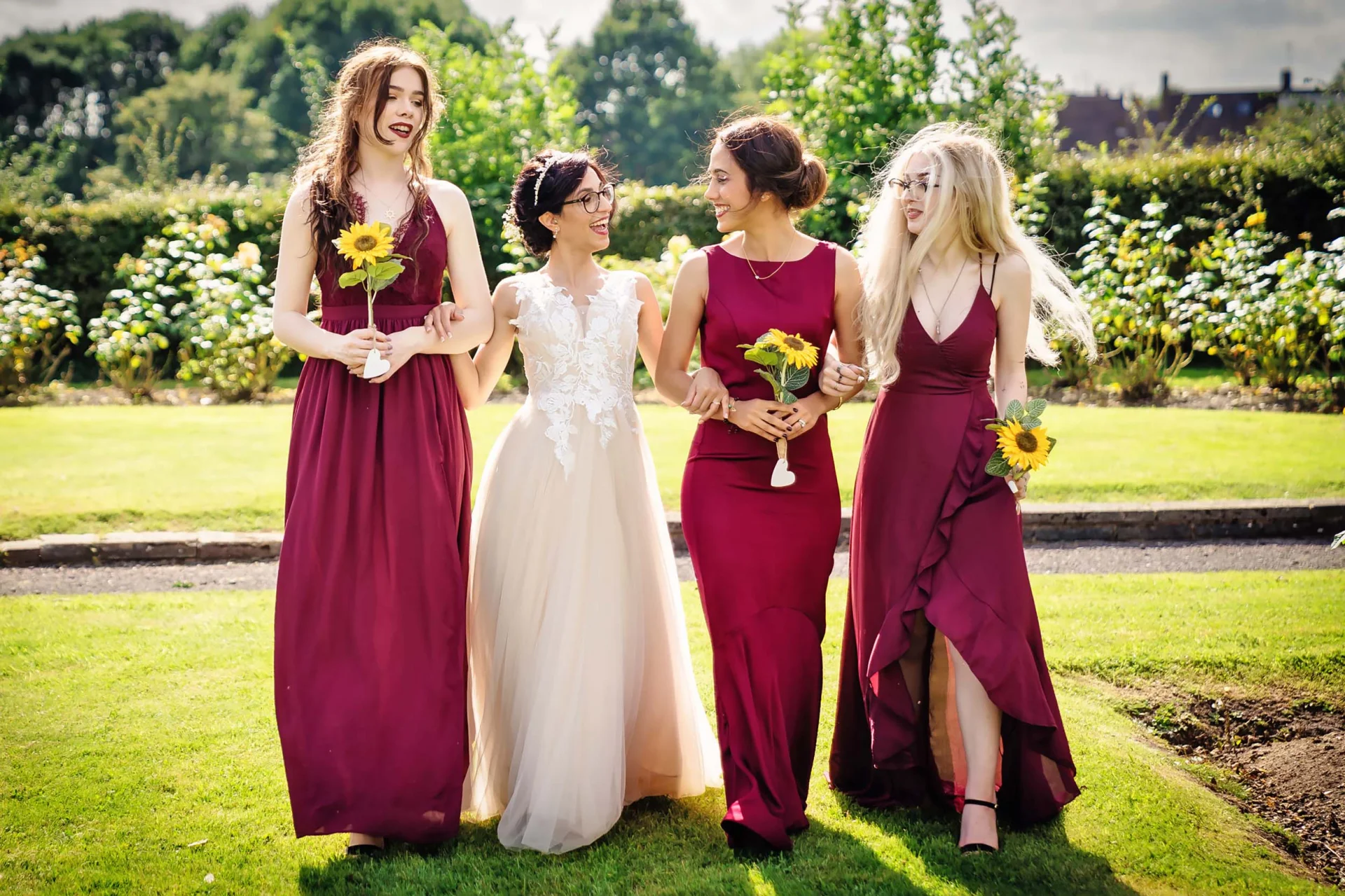 Four inexpensive bridesmaids in rich burgundy dresses. (listing)