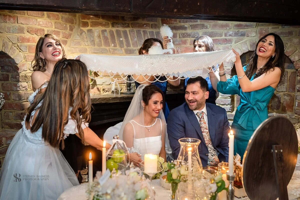 A group of brides and grooms at a wedding.
