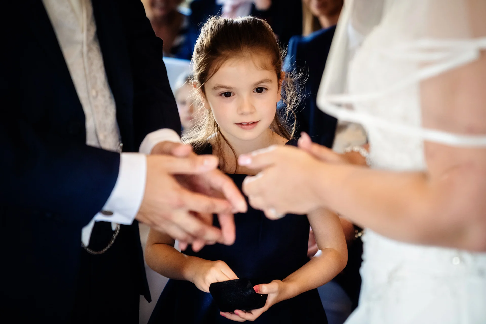 flowergirl-stares-at-rings-wedissimo-wedding (listing)
