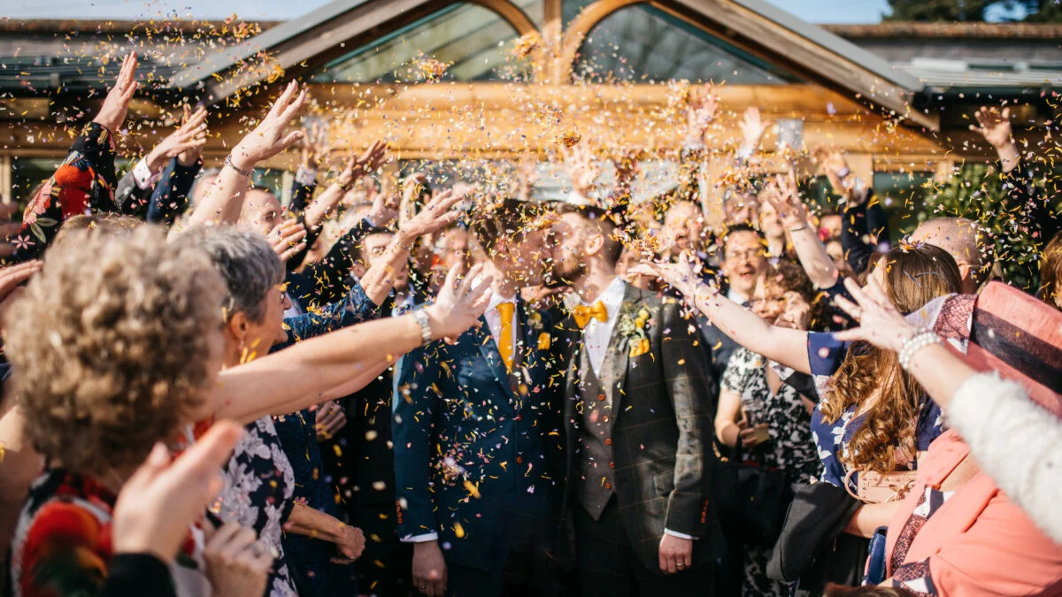 Confetti being thrown at a wedding party.