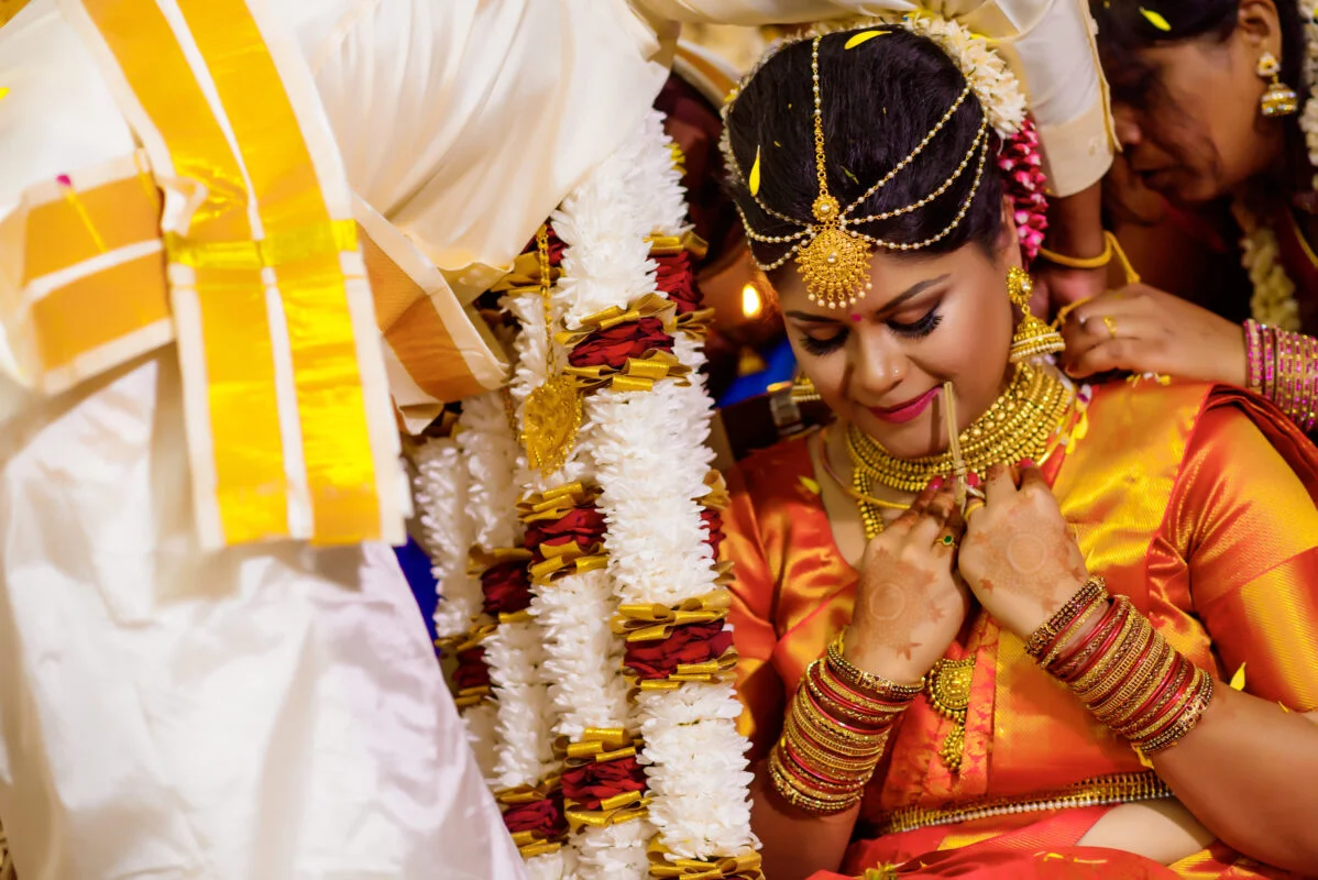 An indian bride is getting ready for her wedding ceremony.