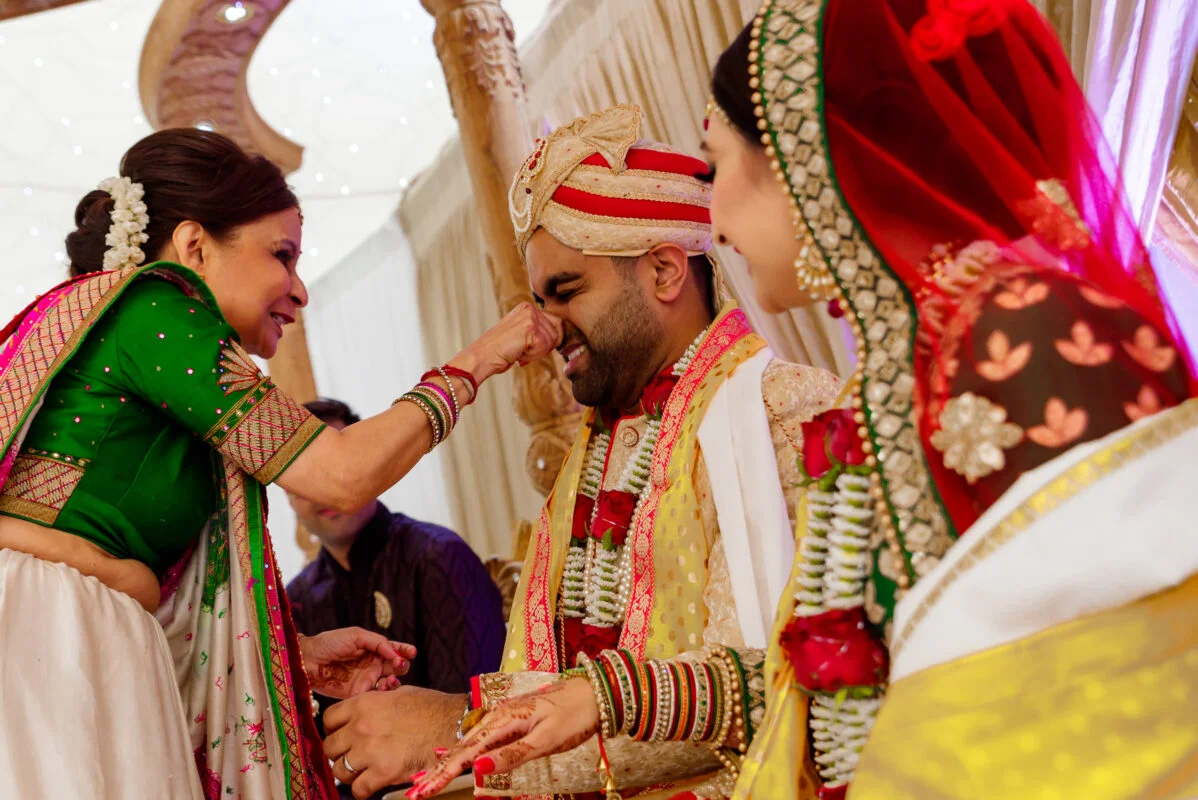 A bride and groom are getting ready for their wedding ceremony.
