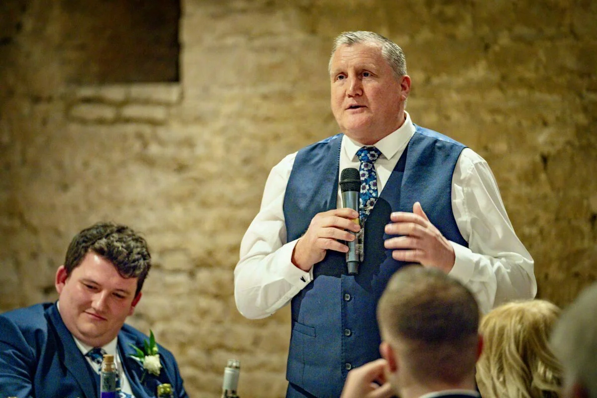 A man speaking into a microphone.