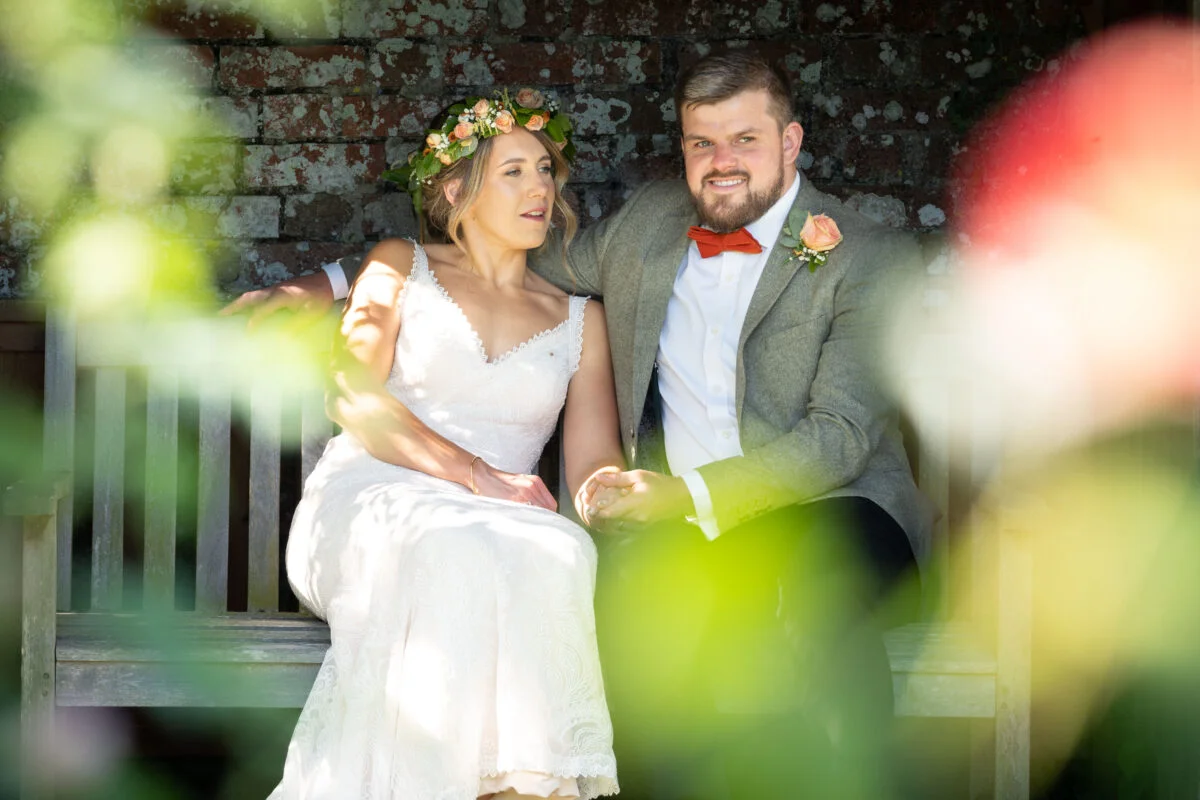 Best wedding photographer capturing a bride and groom in a picturesque garden.