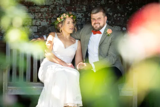 Best wedding photographer capturing a bride and groom in a picturesque garden.