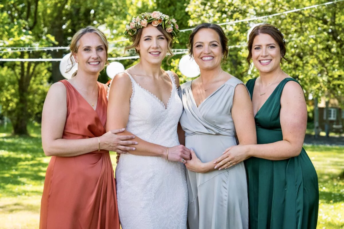 Four bridesmaids posing for a photo.
