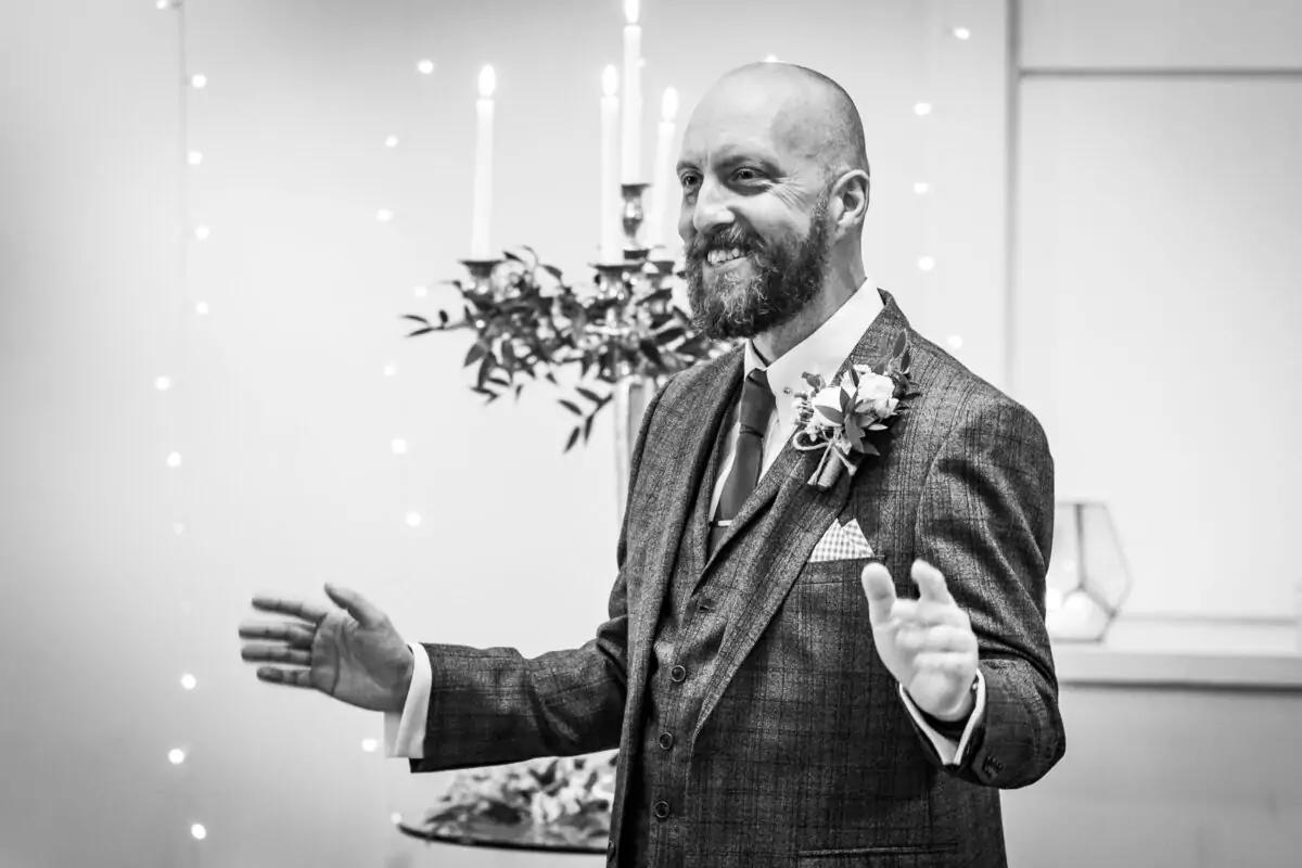 A black and white photo of a man giving a speech.