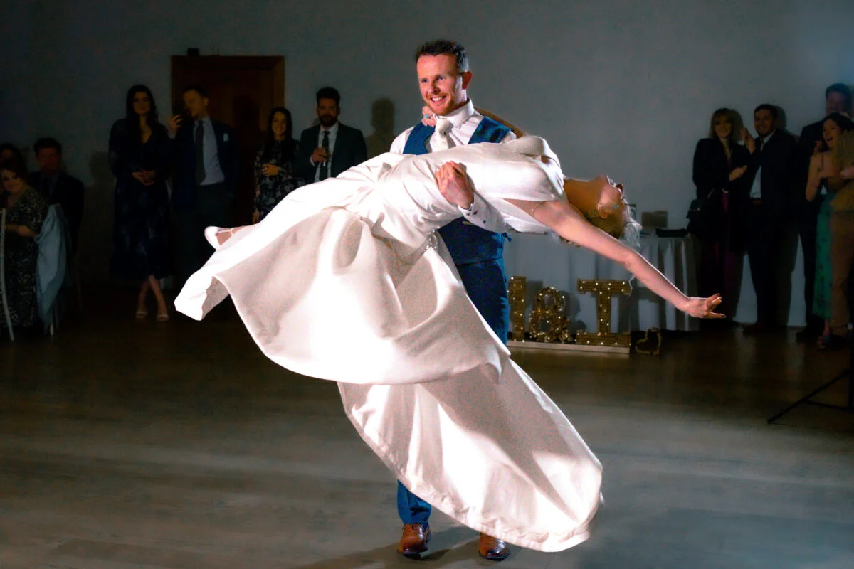 A bride and groom doing a first dance at a wedding.
