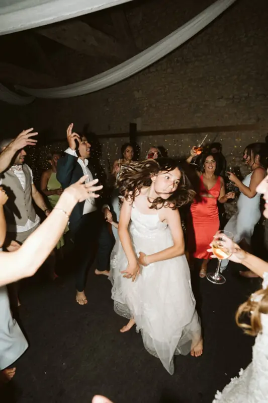 A bride and groom dancing on the dance floor at a wedding.