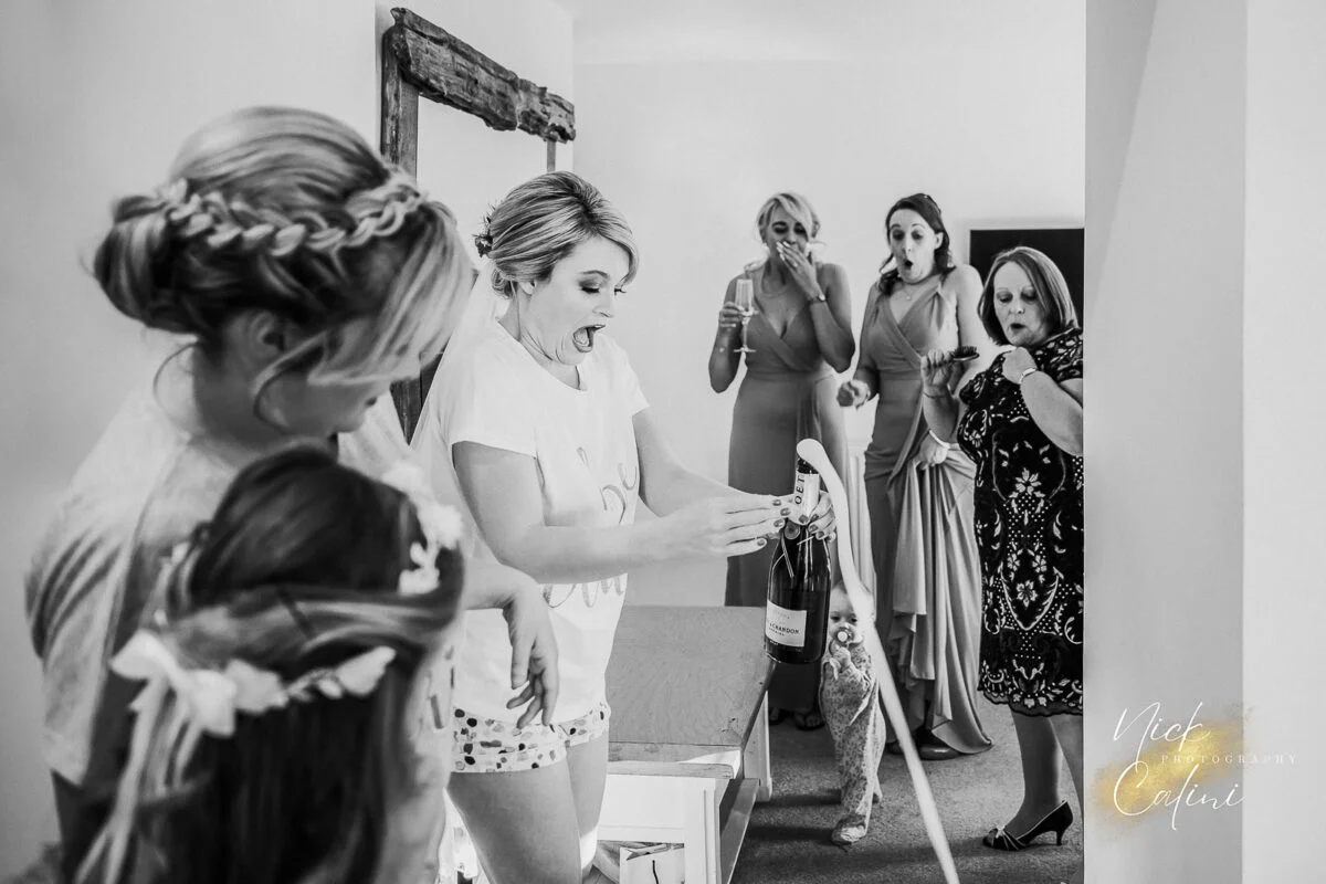 A bride getting ready in front of a mirror.
