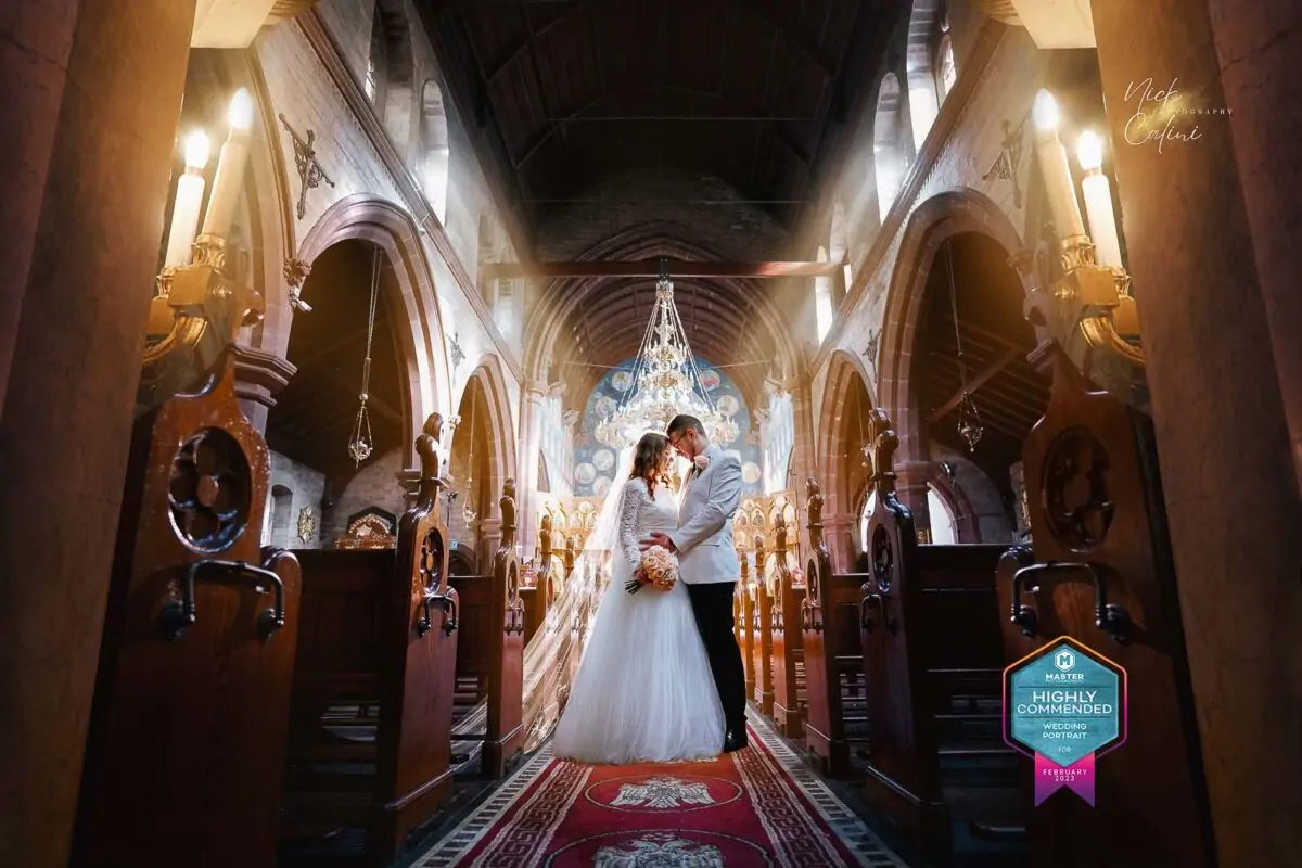 A bride and groom standing in a church.