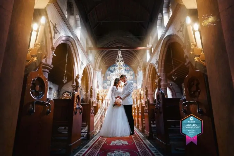 A bride and groom standing in a church.