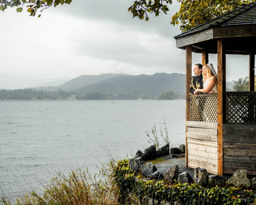 A wooden gazebo on a wooden deck.