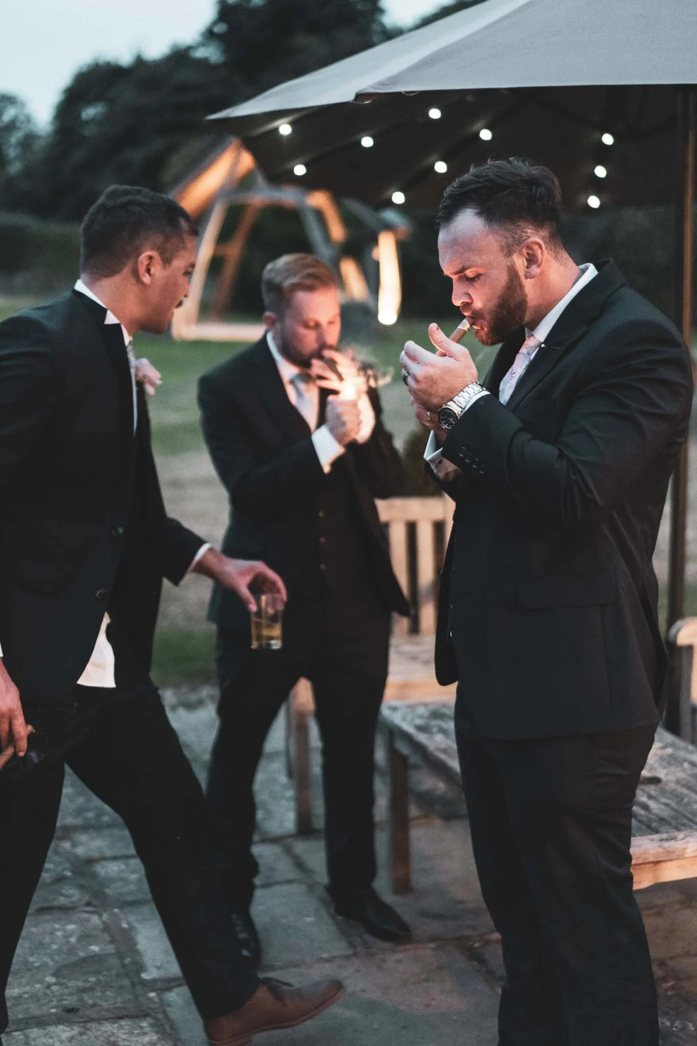 A group of men in suits and ties are discussing fairytale wedding photography. (listing)