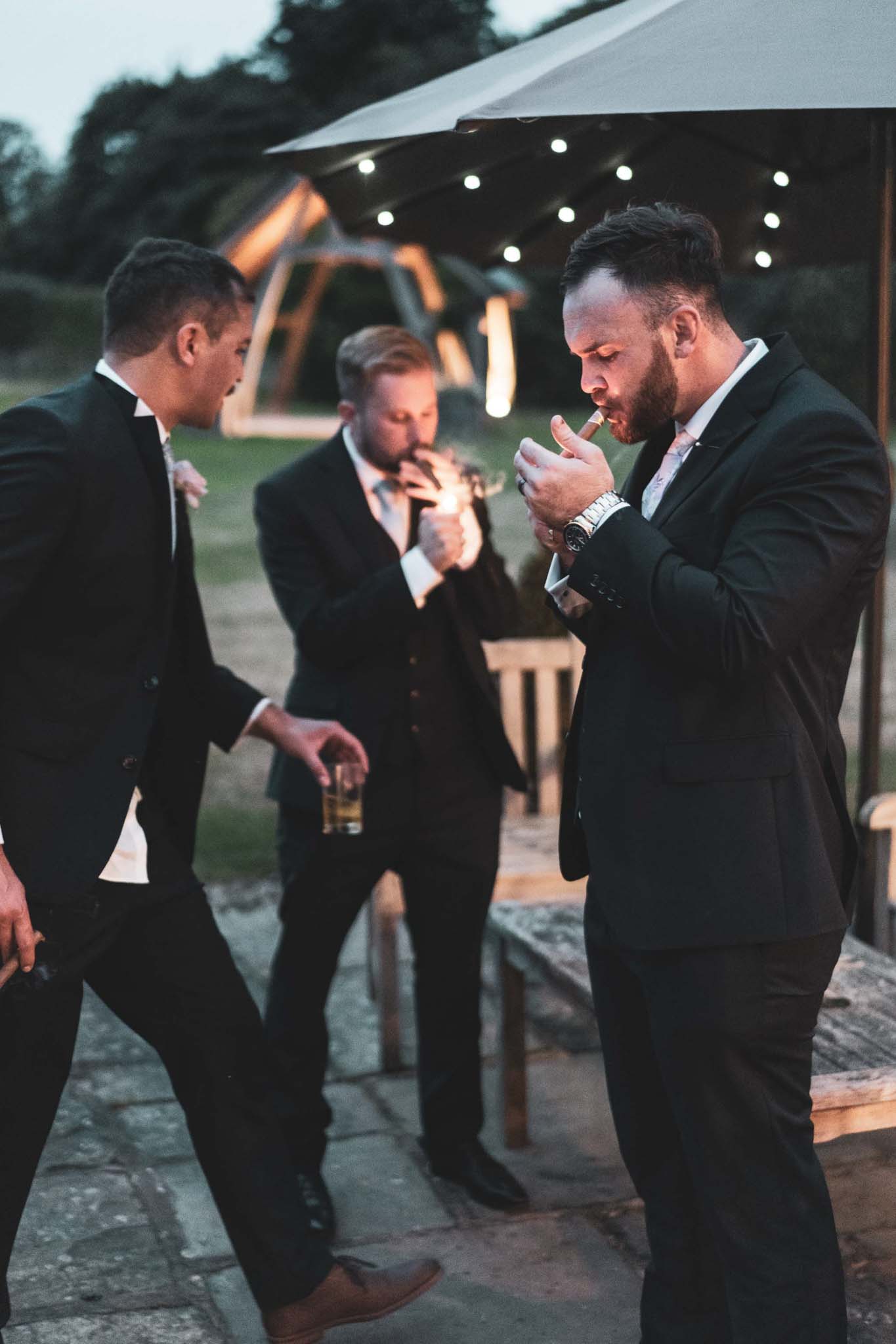 A group of men in suits and ties are discussing fairytale wedding photography. (listing)