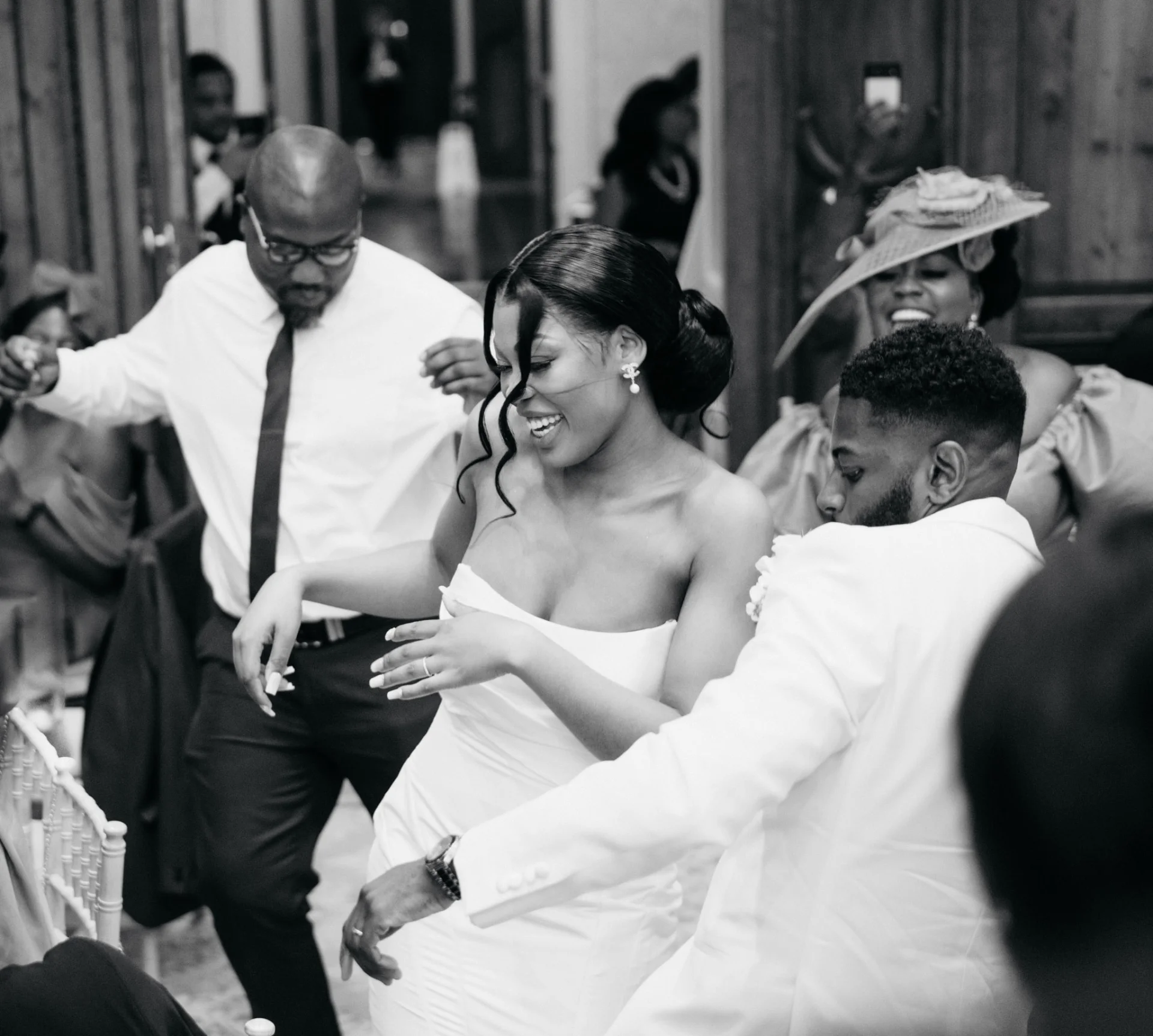 A fairytale bride and groom dancing in a black and white wedding photography. (listing)