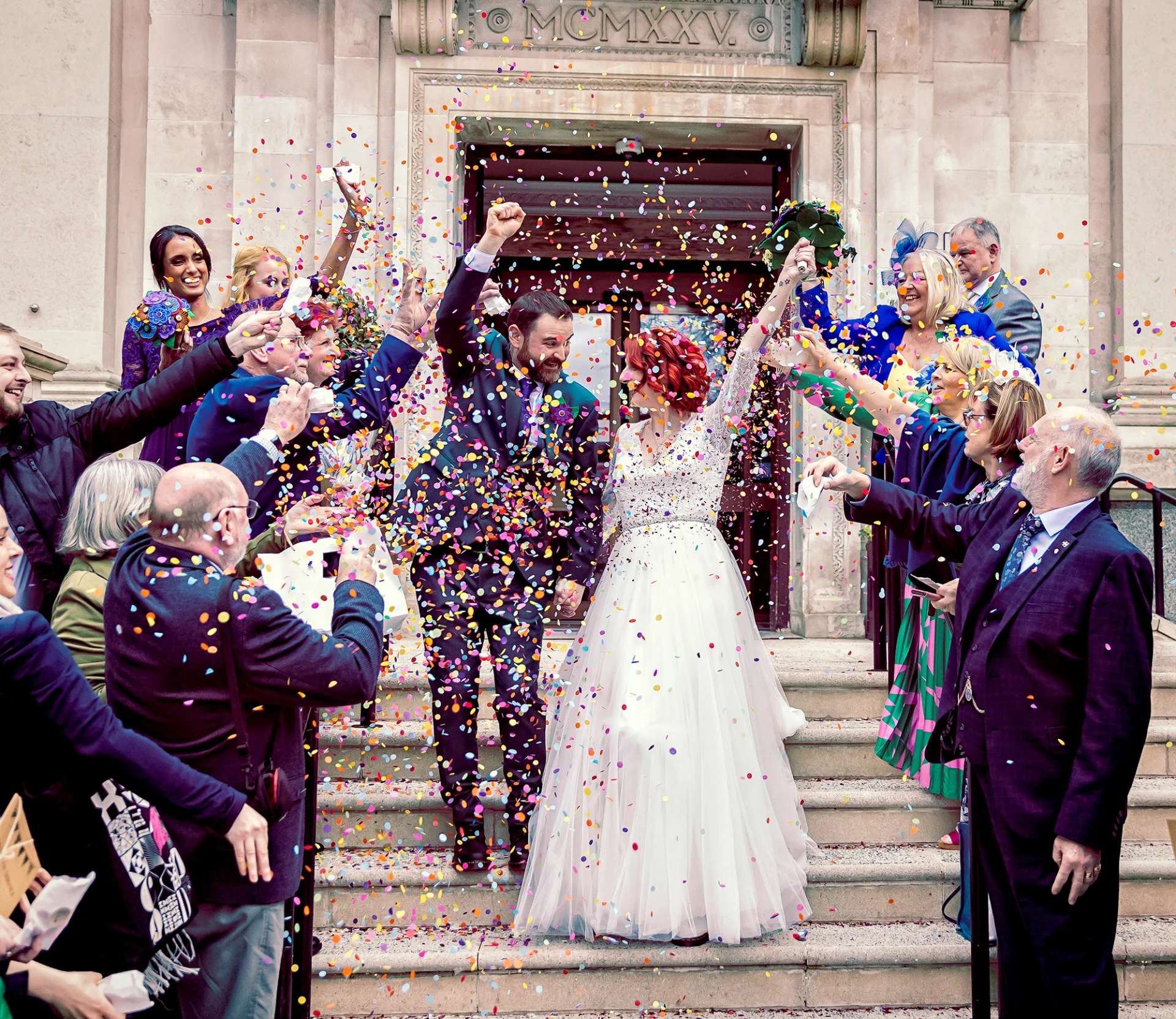 Wedding photographer duo capturing confetti-filled celebrations. (listing)
