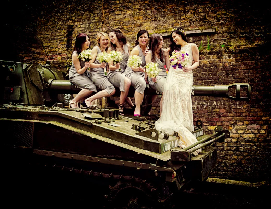 Bridesmaids-sit-on-tank-again-at-London-Islington-wedding-day-image-Big-Day-Weddings