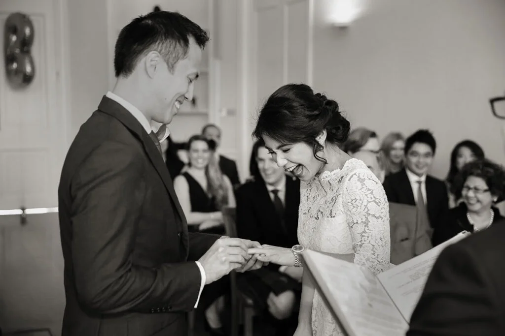 London-wedding-couple-exchanging-rings-at-Asia-House-photo