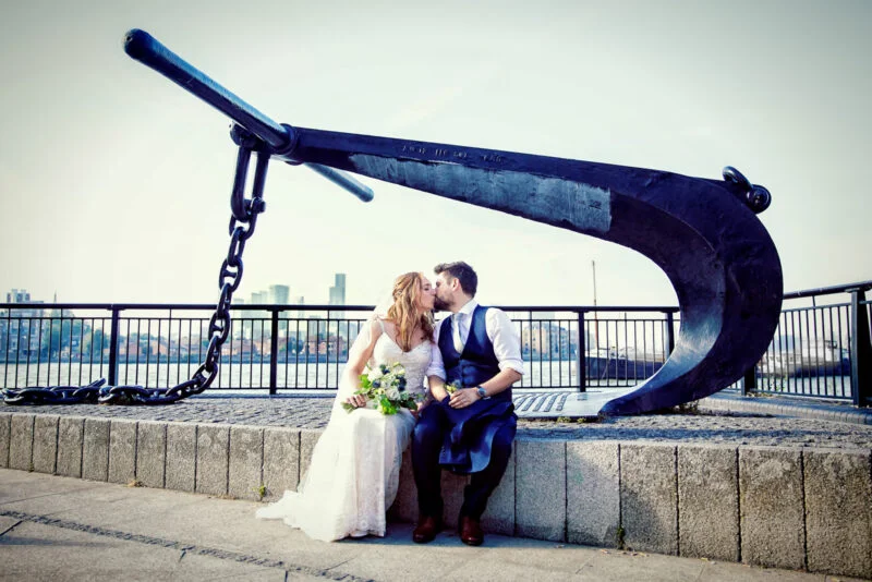 Bride-and-groom-kisss-by-anchor-cutty-sark-Greenwich-wedding - Big Day Weddings