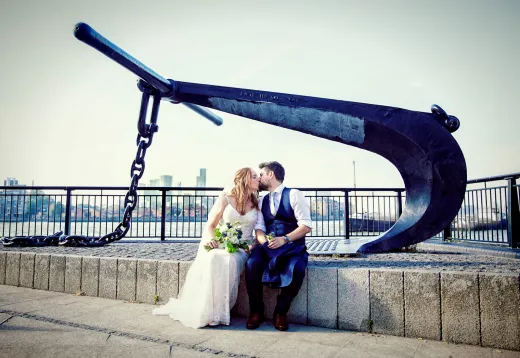 Bride-and-groom-kisss-by-anchor-cutty-sark-Greenwich-wedding - Big Day Weddings