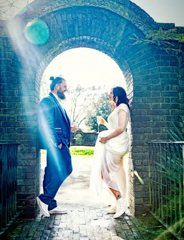 York-House-Wedding-Twickenham-couple-in-arch (2)