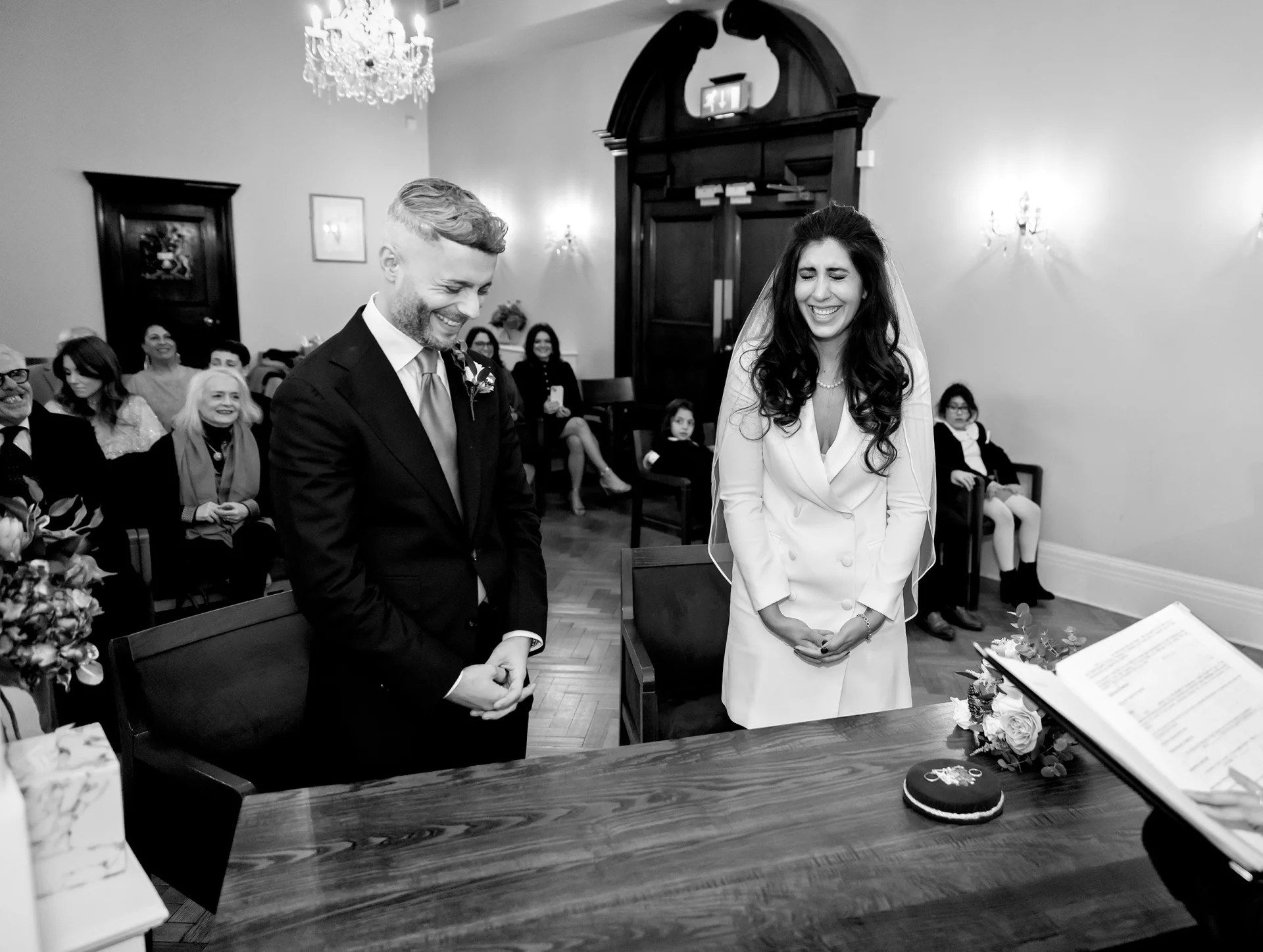 Bride-and-groom-laugh-during-Chelsea-old-town-hall-wedding (listing)