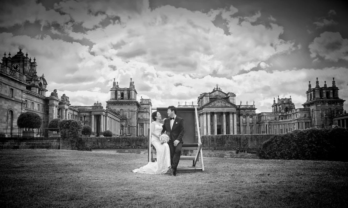 Bride-and-groom-in-deckchair-at-Blenheim-Palace-wedding (listing)