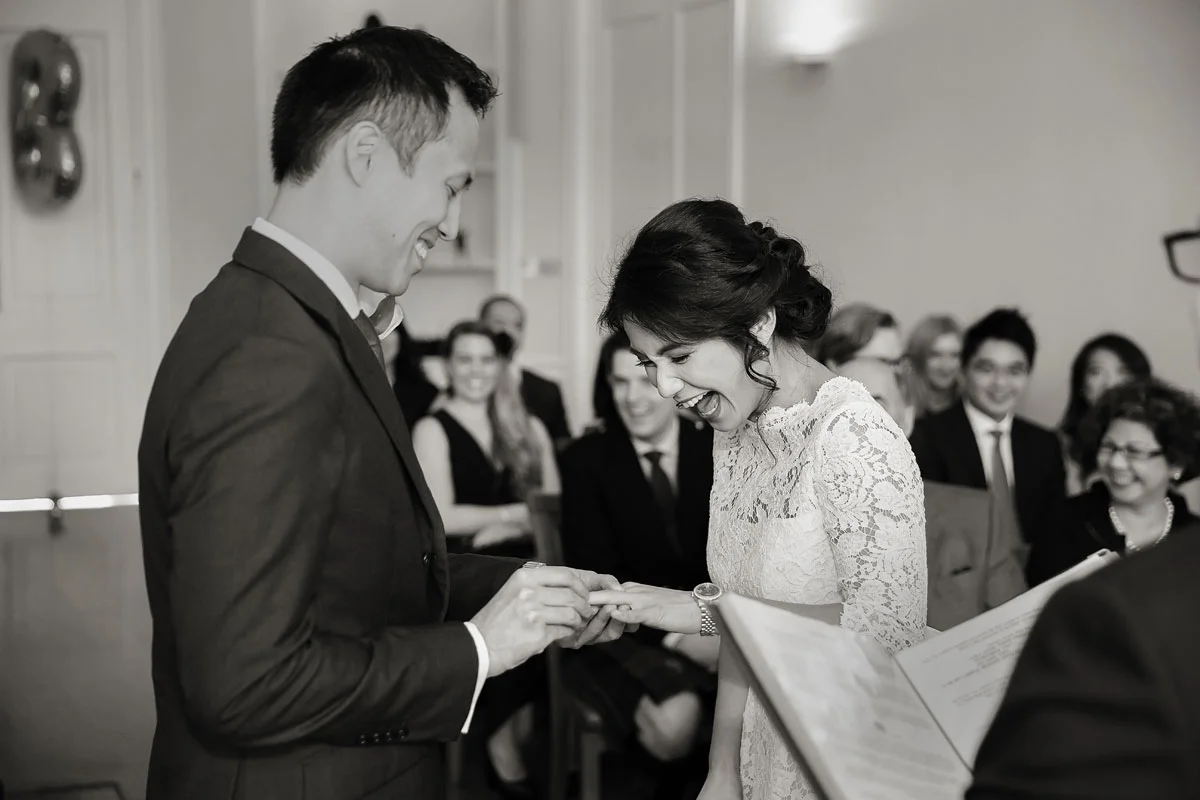 London-wedding-couple-exchanging-rings-at-Asia-House-photo (listing)
