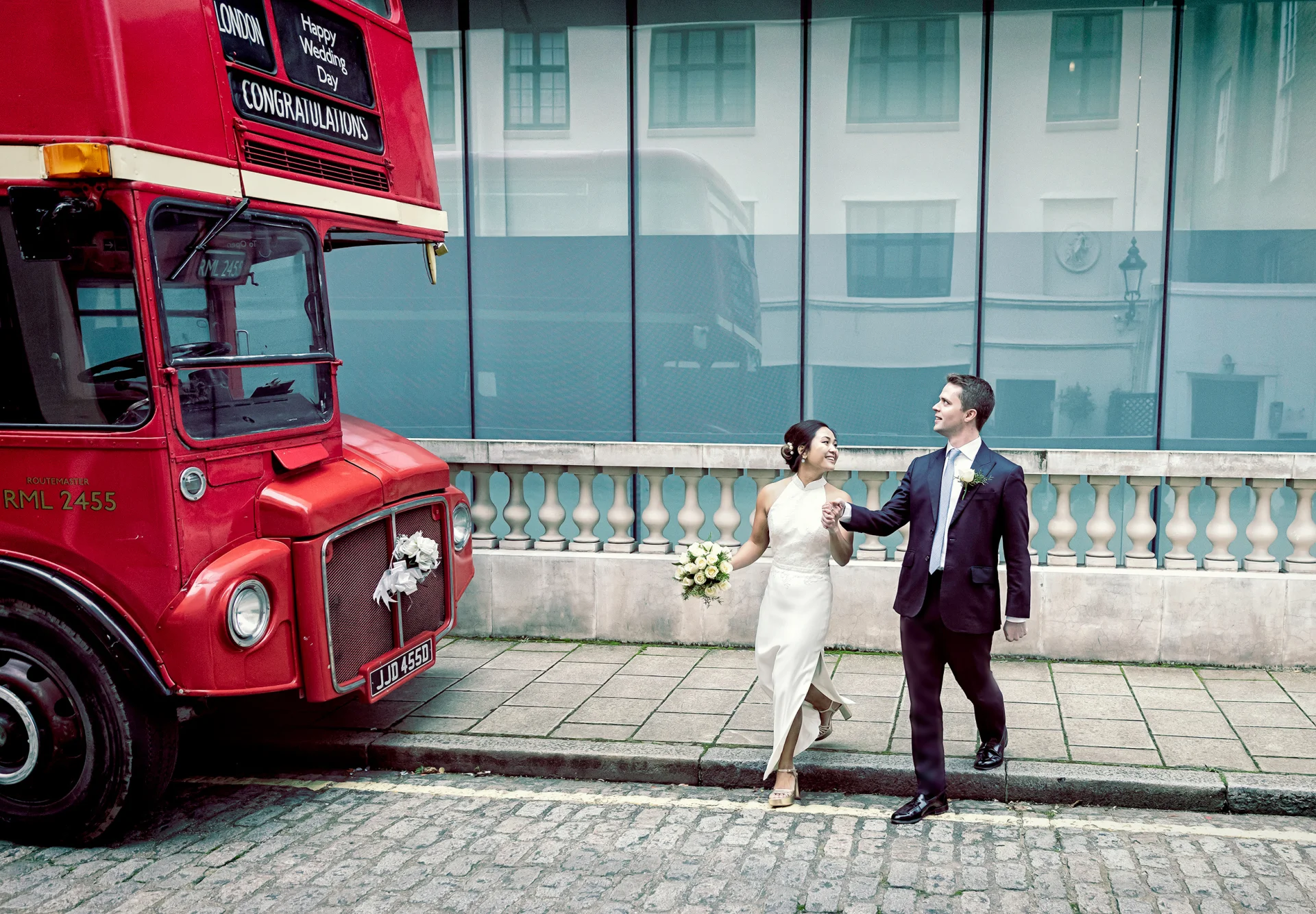 Old-Marlyebone-Town-Hall-wedding-couple-walk-to-London-bus (listing)