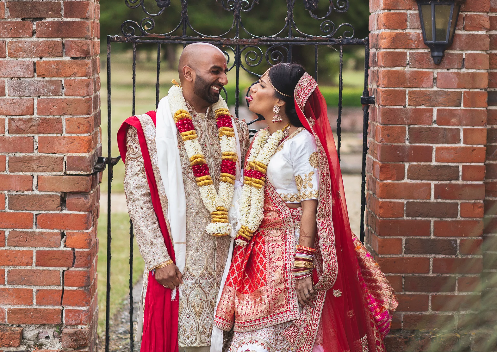 Hindu-wedding-couple-having-fun-Warbrook-House-garden (listing)