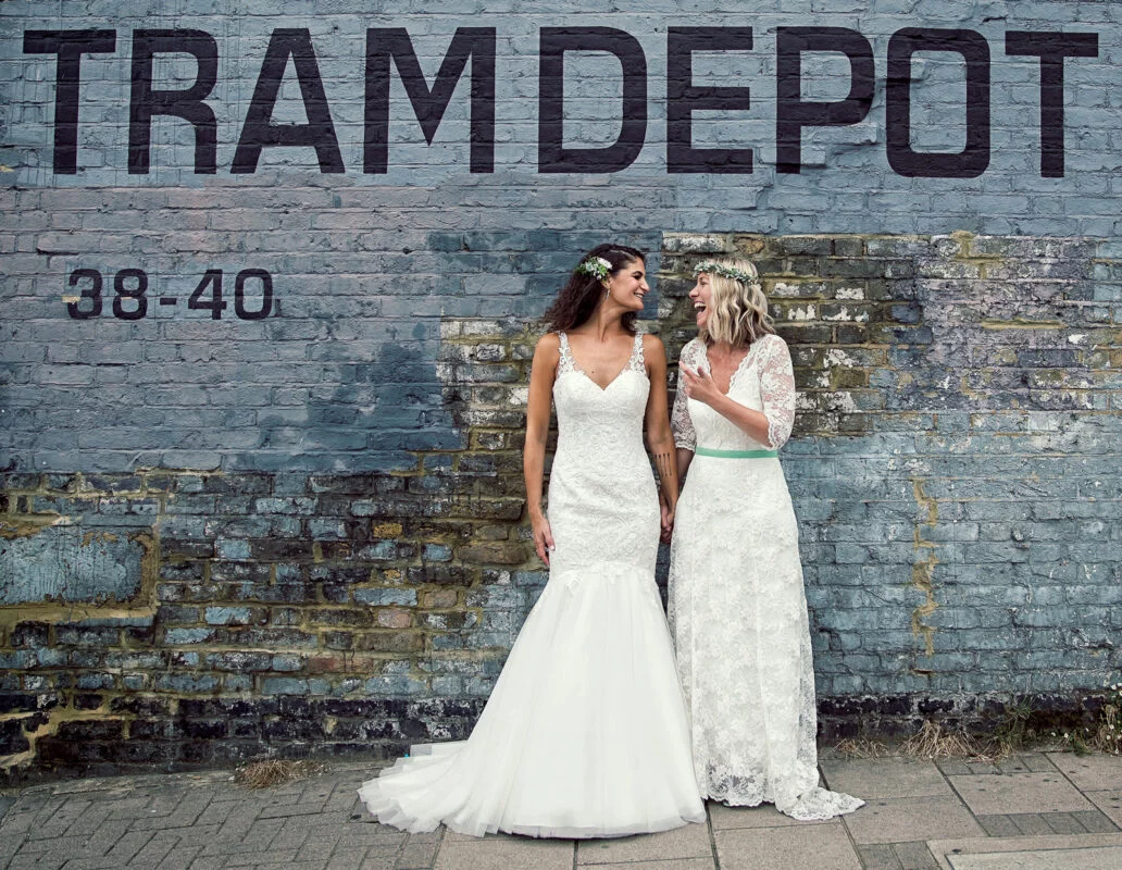 Clapton-Country-Club-wedding-day-two-brides-laugh-image-2