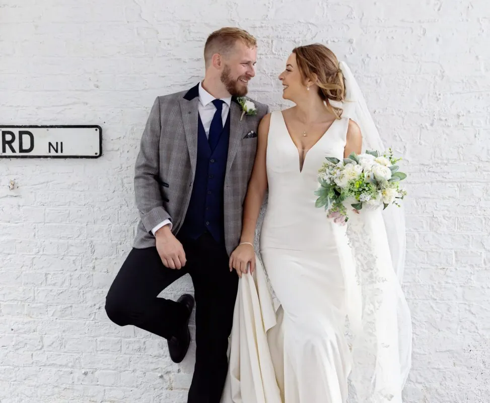 Islington-Town-Hall-wedding-couple-by-white-wall-image