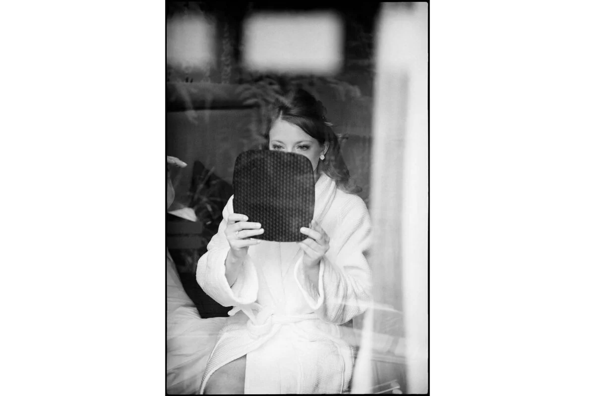 bride_looking_into_mirror-2x-c91b3d28